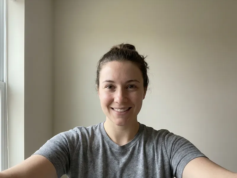 A good selfie: one person facing the camera, the whole face visible in soft daylight, no sunglasses